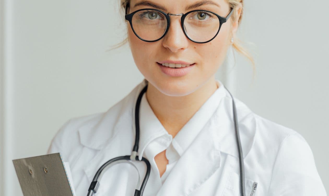 Clinical team doing rounds in a hospital hallway — residency program