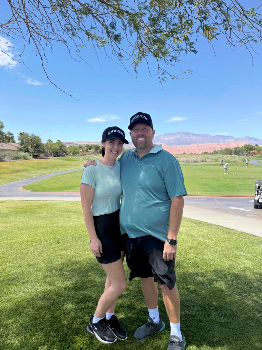 Michael Christensen, D.O. and Ashley Christensen at a Clubs & Scrubs golf event