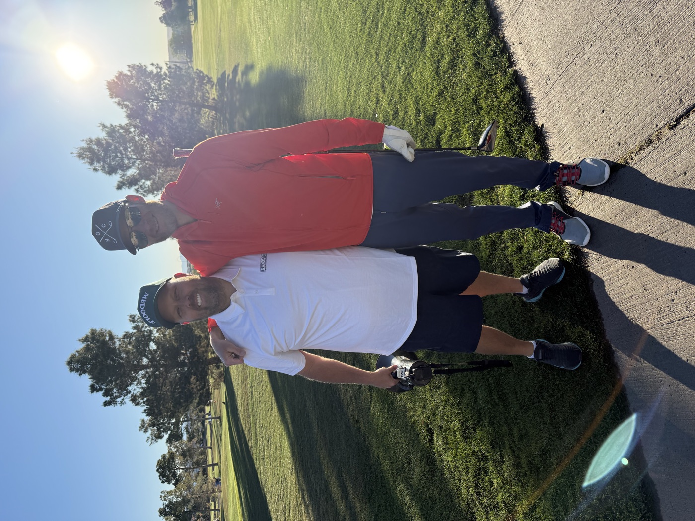 Golfers on the course at a Clubs & Scrubs physician wellness event